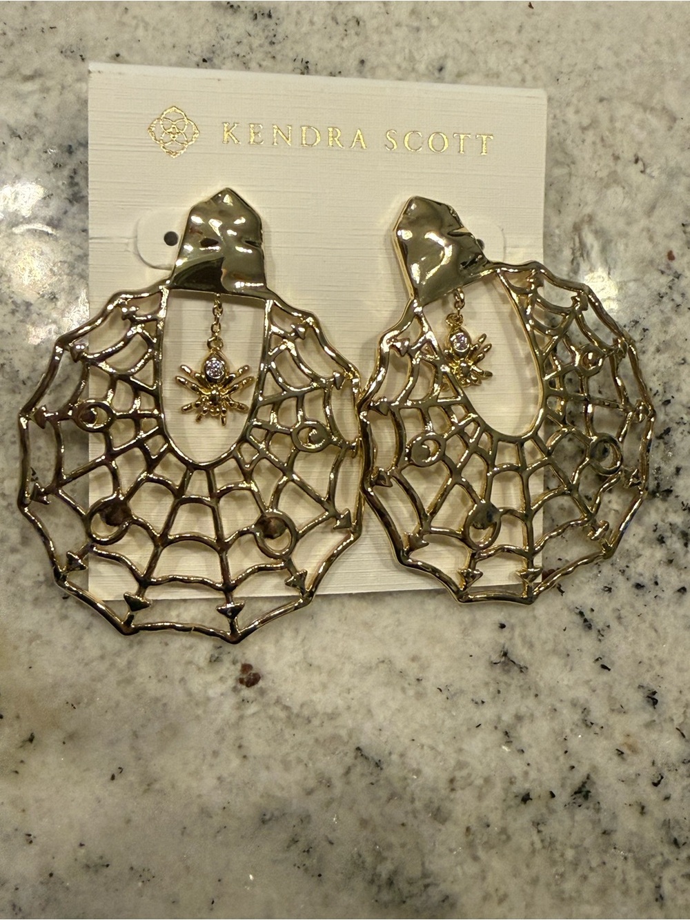 Kendra Scott Large Gold Spider Web Statement Earrings with dangling spider charm